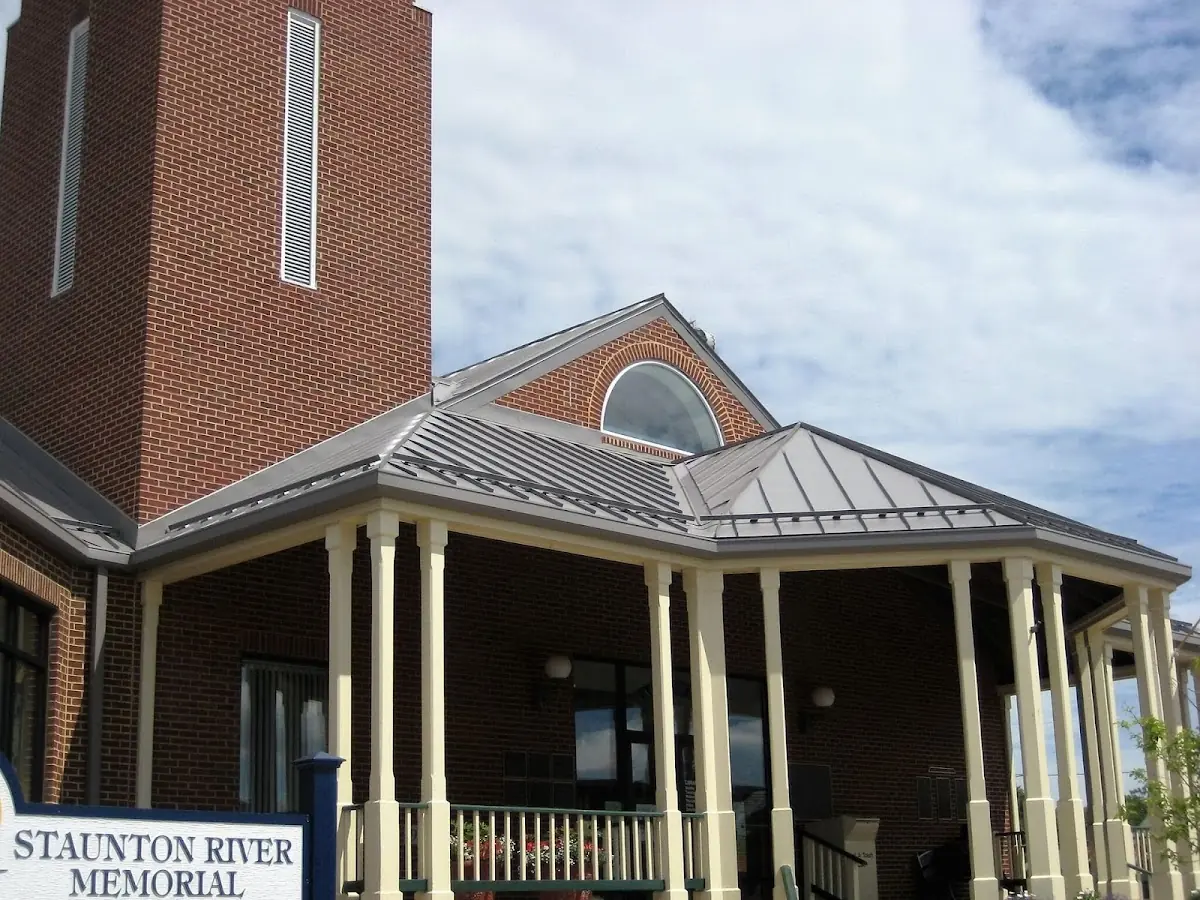 Skilled roofing craftsmen working on a residential roof in Pineville